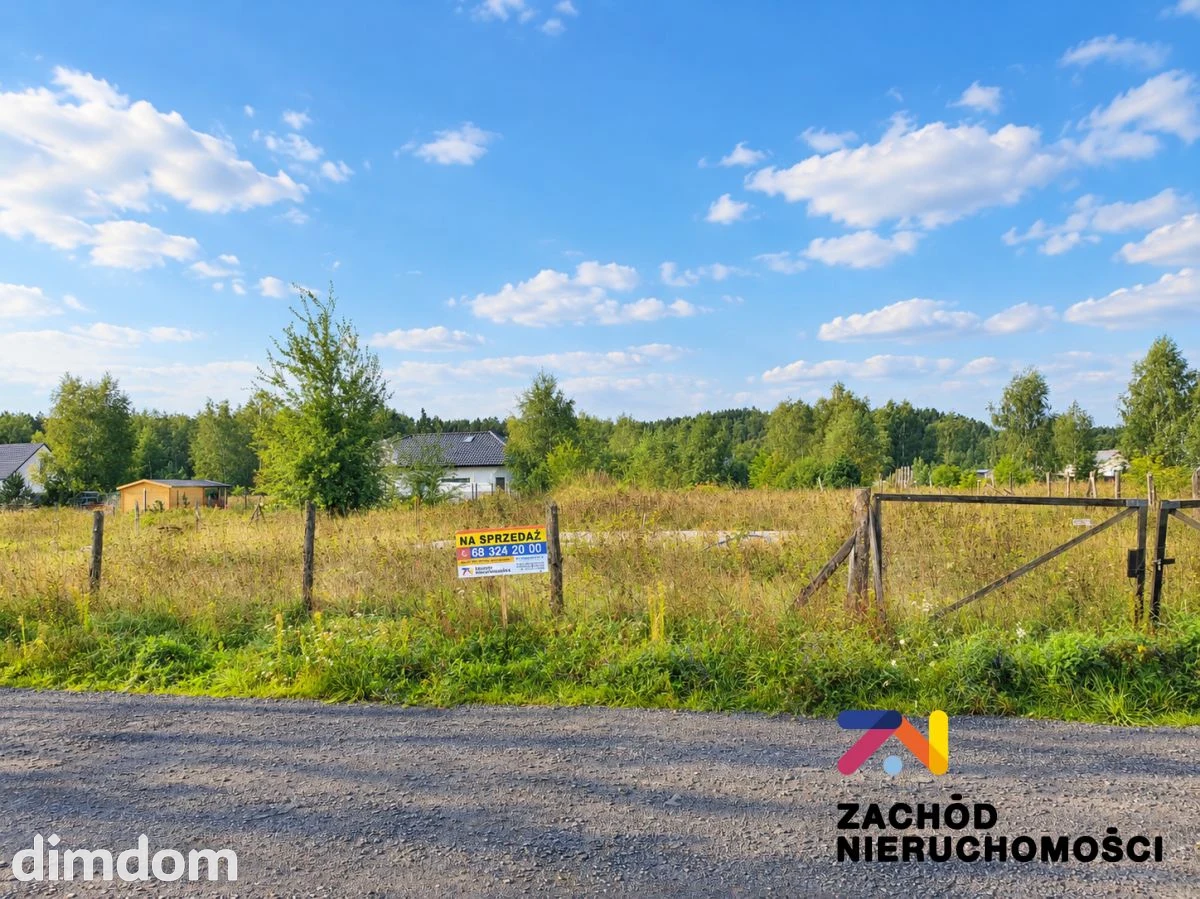 Oferujemy Państwu na sprzedaż atrakcyjną działkę budowlaną o powierzchni 1218 m, położoną w malowniczej miejscowości Droszków, zaledwie kilka kilometrów od Zielonej Góry. - 168450227-1l.jpg